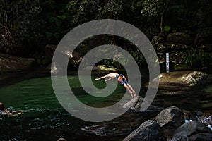 Guy jumping to the water