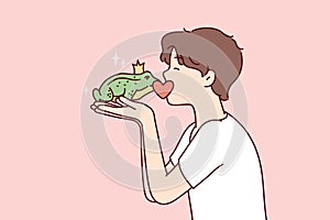 Guy kisses frog princess with crown on head, wishing that animal turned into girl. Vector image