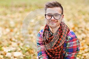 Guy laughing in the autumn park.