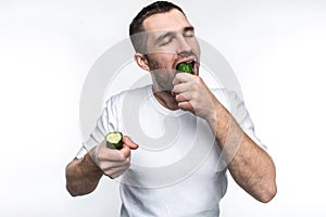 This guy likes to eat natural and organic fruit and vegetables. On this picture he has two pieces of one long cucumber