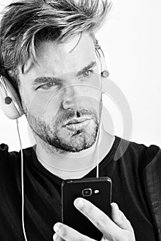 Guy listening to sound track in headset. ebook and online education. music education. sexy muscular man listen ebook