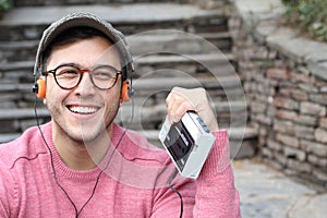 Guy listening to Stereo cassette Walkman in the 80s or the 90s