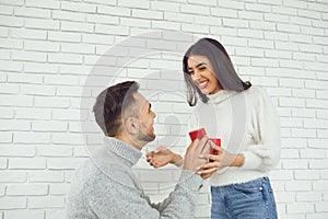 The guy makes a marriage proposal to the girl.