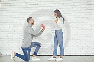 The guy makes a marriage proposal to the girl.