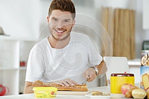 Guy making sandwhich at home