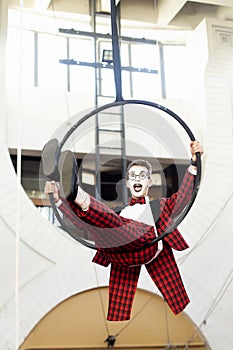 Guy mime riding a hoop