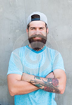 Guy modern outfit. Casual and comfortable. Hipster lifestyle. Cool hipster with beard wear stylish baseball cap. Brutal