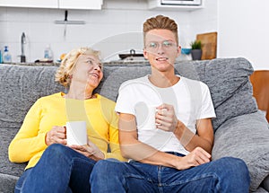 Guy and mother spending time together at home