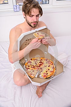 Guy naked covered pizza box sit bed bedroom offer you join him. courier delivers gastronomic satisfaction