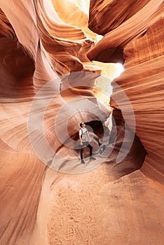 A guy in narrow cave of Antelope Canyon