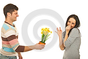 Guy offering flowers to picky woman