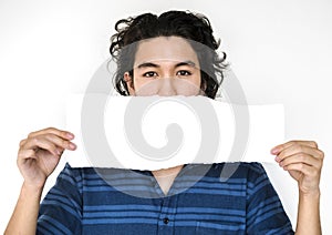 A guy with a placard in a shoot photo