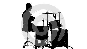 Guy plays the music on the drum. White background. Silhouettes. Side view