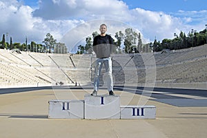 The guy on the podium of the Olympic stadium Panathinaikos, Athens, Greece.