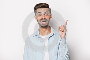 Guy raised finger up gesture of resourceful person studio shot