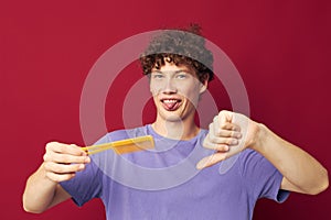 guy with red curly hair comb hair care posing isolated background