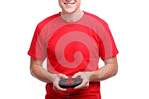 Guy with a smile playing on the joystick on a white isolated background