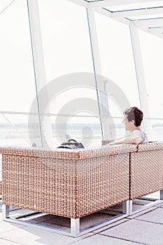 Guy resting in airport lounge