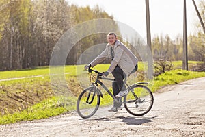 A guy riding a bike on rural roads