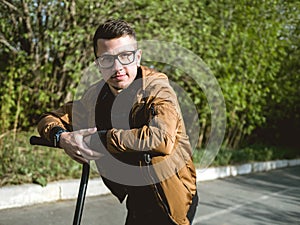 The guy riding on the kickscooter