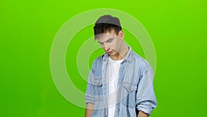 Guy is sad, he has a sorrowful look, he is upset. Green Screen