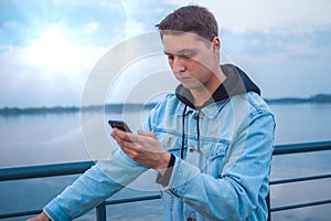 A guy on a scooter with a phone