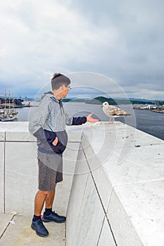 The guy and seagull. Oslo Opera House, Norway