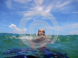 Guy snorkling in the sea photo