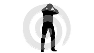 Guy is standing in the studio, and the noise annoys him. Silhouette. White background