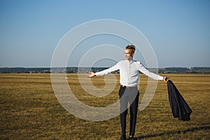 A guy in a suit walks on the field