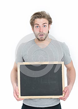 Guy or surprised man holding blackboard isolated on white background