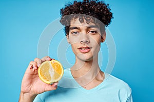 guy t-shirt with orange in his hands fruit healthy food