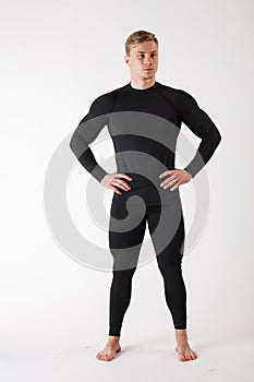 The guy in thermal underwear on a white background. Sportswear.