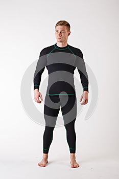 The guy in thermal underwear on a white background. Sportswear.