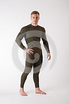 The guy in thermal underwear on a white background. Sportswear.