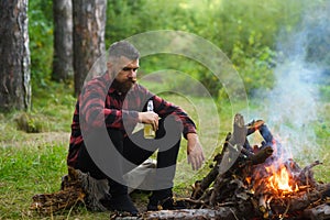 Guy with tired face and lonely at picnic, barbecue.