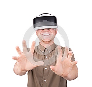 A guy trying to touch or embrace with hands virtual objects in a digital simulation. A young man in a virtual glasses. VR device.