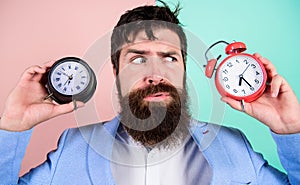 Guy unshaven puzzled face having problems with changing time. Changing time zones affect health. Time zone. Does