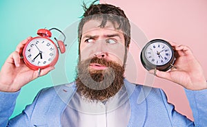 Guy unshaven puzzled face having problems with changing time. Changing time zones affect health. Time zone. Does