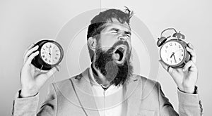 Guy unshaven puzzled face having problems with changing time. Time zone. Changing time zones affect health. Does