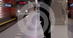 The guy uses the phone for the arrival train. He buys an e-ticket at the station