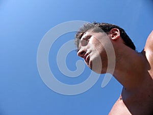 Guy watching the long view in the sea photo