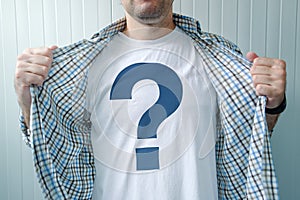 Guy wearing white t-shirt with question mark