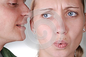 A guy whispering something strange and interesting photo