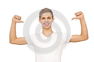 A guy in a white T-shirt with his hands up in the studio, isolate