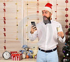 Guy on wooden wall background reads message. Man with beard