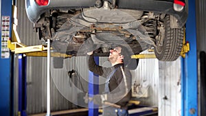 Guy work at car service car problem expertise repair. 4K