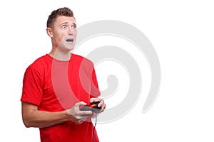 Guy frightened with a joystick in hands on a white isolated background