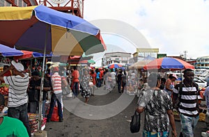 Guyana, Georgetown: Customers and Sales Booths at Stabroek Market