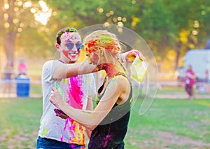 Guys with a girl celebrate holi festival